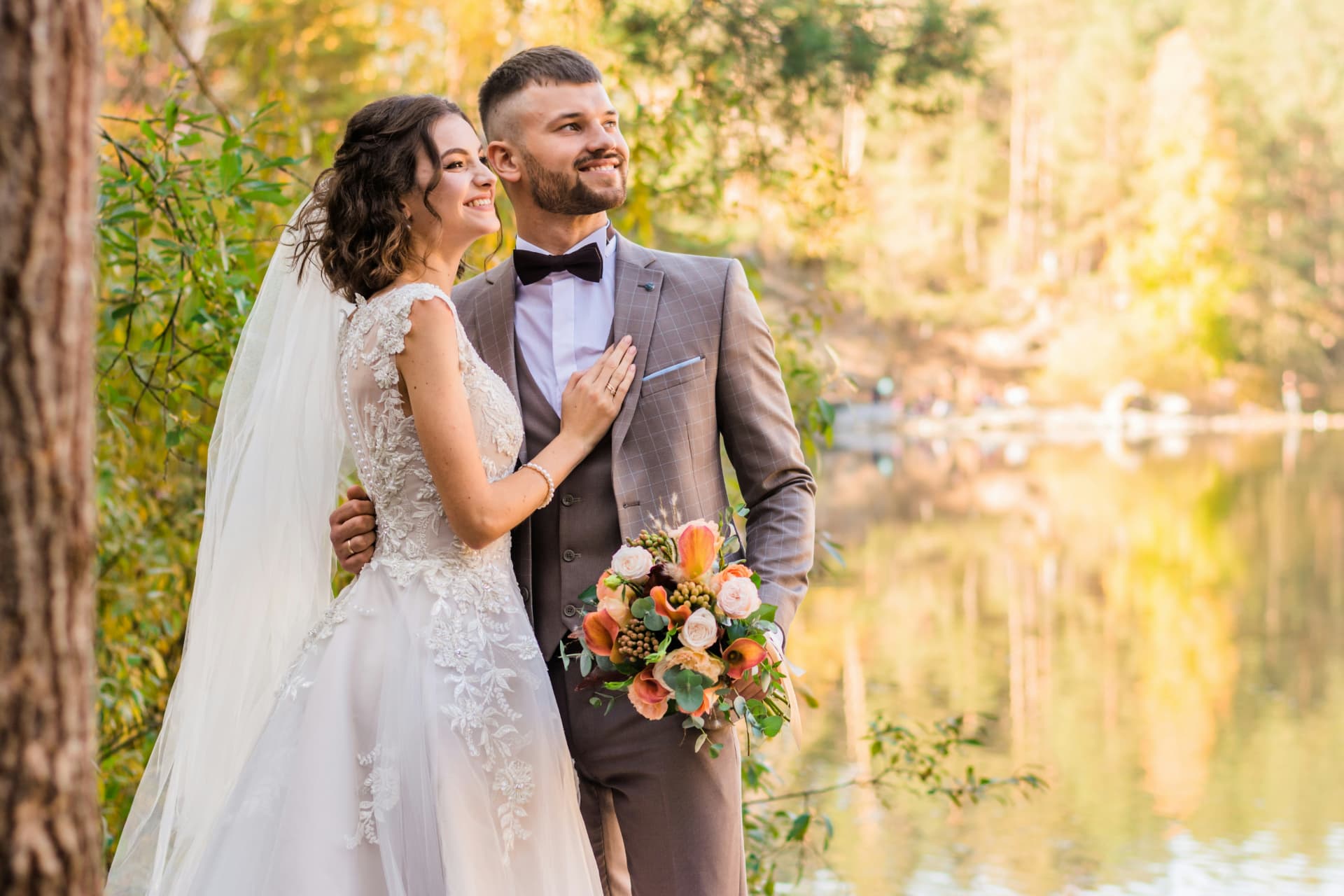 Smiling couple by the lake