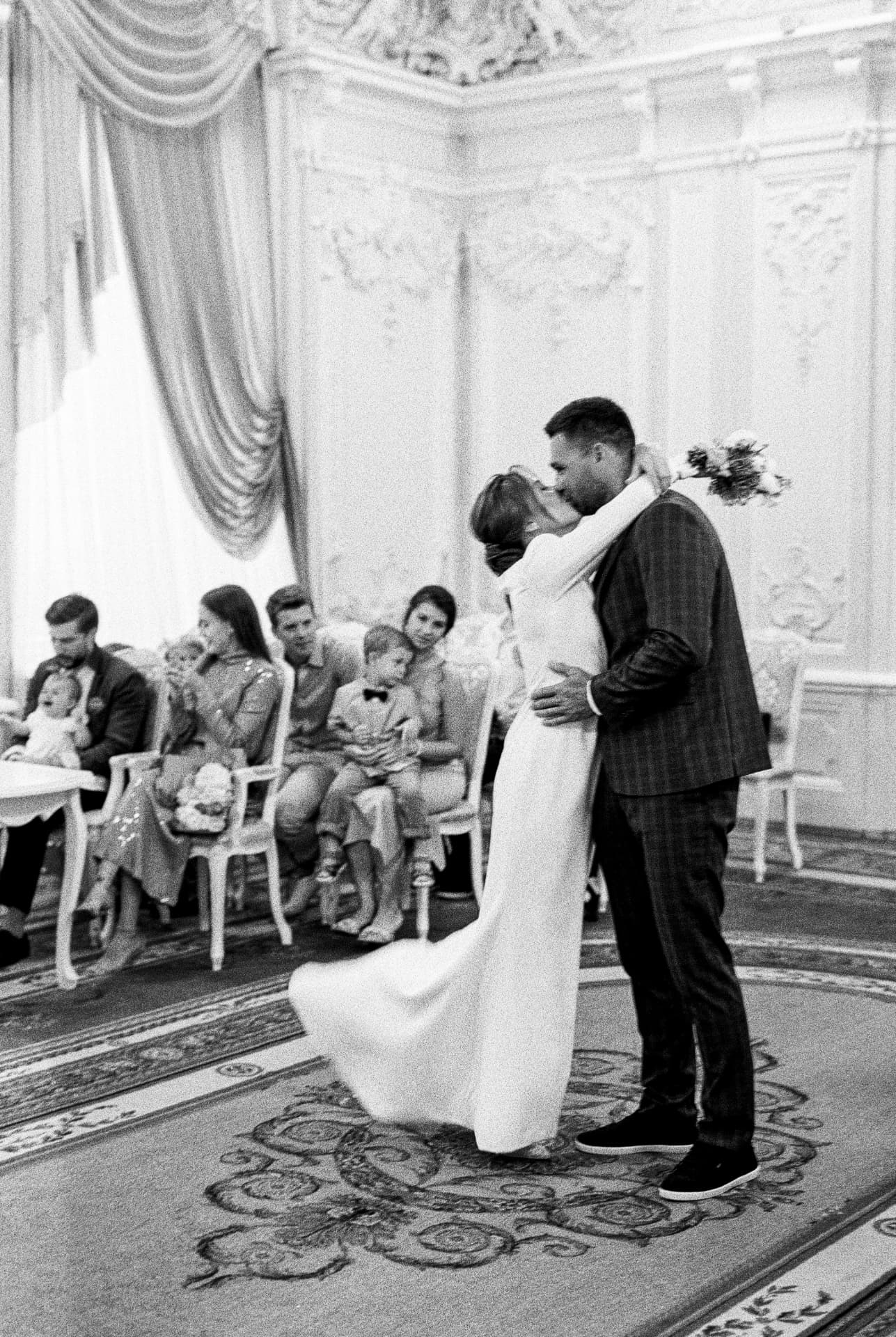 First kiss during the ceremony, black and white