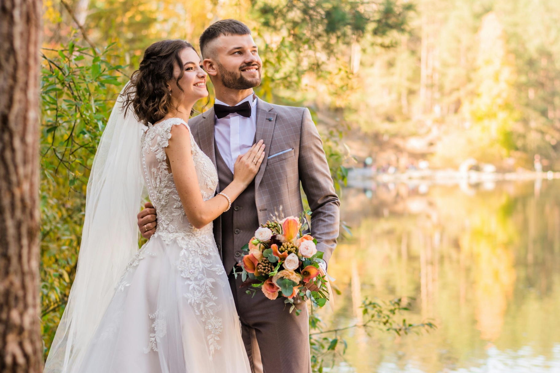Smiling couple by lake